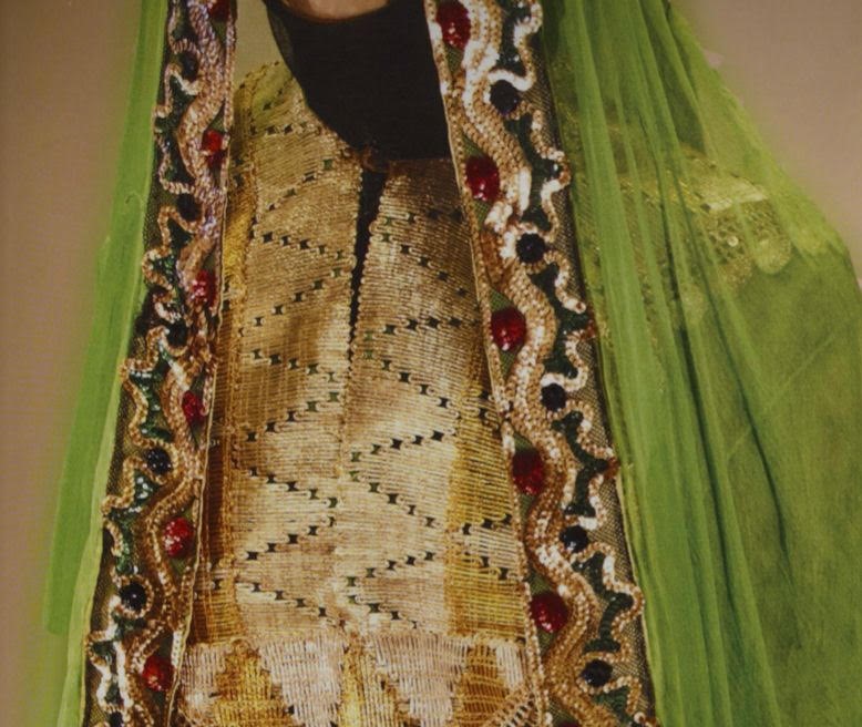 One of Princess Nourah's famous dresses, woven from soft chiffon in light green, with wide sleeves, decorated with a circular geometric shape and filled with colored sequins. Photo supplied from “Nourah bint Abdulrahman bin Faisal bin Turki Al-Saud an Illustrated Biography.”