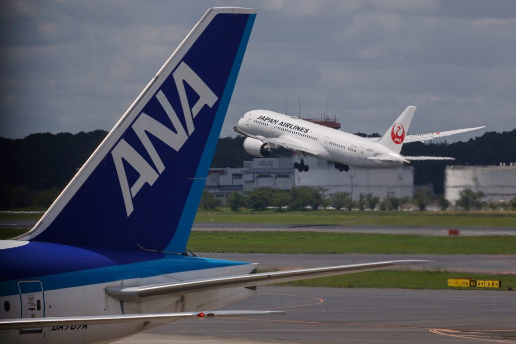 ANA Holdings Inc. said Friday it expects to post a consolidated net loss of 100 billion yen for the fiscal year ending in March 2022, marking a second straight year of loss. (AFP)