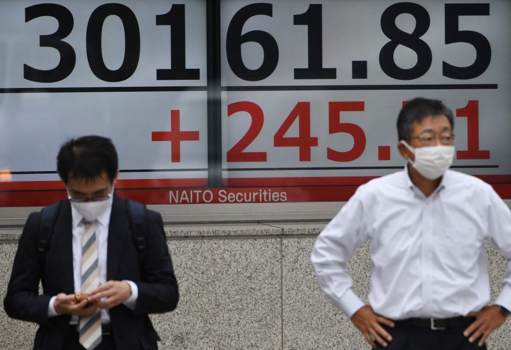 The Nikkei share average fell 0.94% to close at 28,230.61. (AFP)