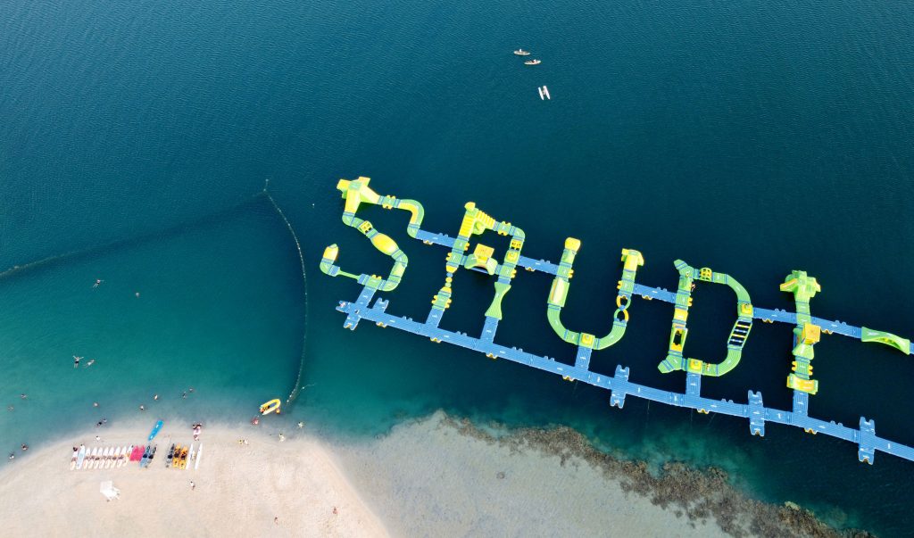 A picture shows a floating blow-up water park that spells 