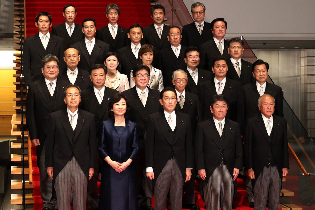Japan's new Prime Minister Fumio Kishida (front C) poses with members of his cabinet at the prime minister's official residence in Tokyo, Oct. 4, 2021. (AFP)