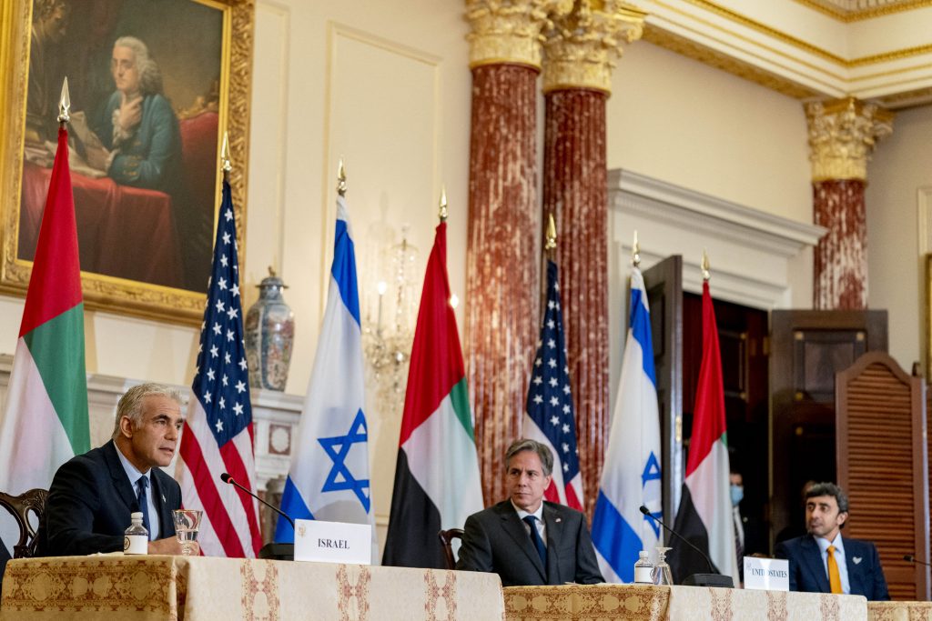 Israeli FM Yair Lapid (L), accompanied by Secretary of State Antony Blinken (C) and UAE FM Sheikh Abdullah bin Zayed, speaks during a joint news conference at the State Department in Washington, DC on Oct. 13, 2021. (AFP)