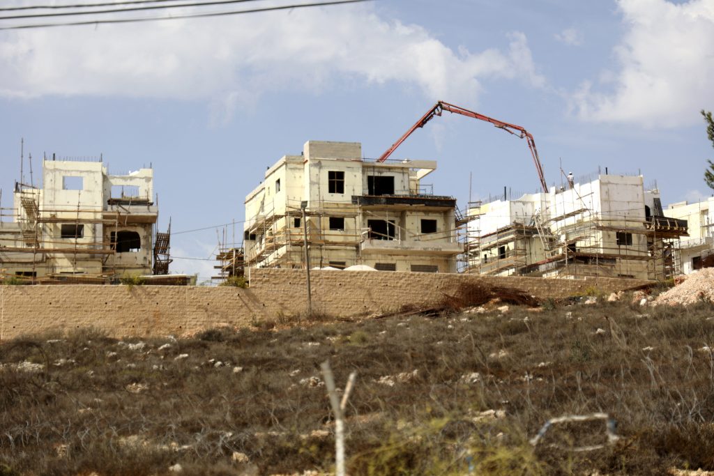 This file photo taken on October 13, 2021, shows construction in the Israeli settlement of Rahalim, located near the village of Yatma, south of Nablus in the occupied West Bank. Israel plans to build more residences for Jewish settlers in the occupied West Bank, a government ministry said, adding to those announced in August by the new ruling coalition. (AFP)