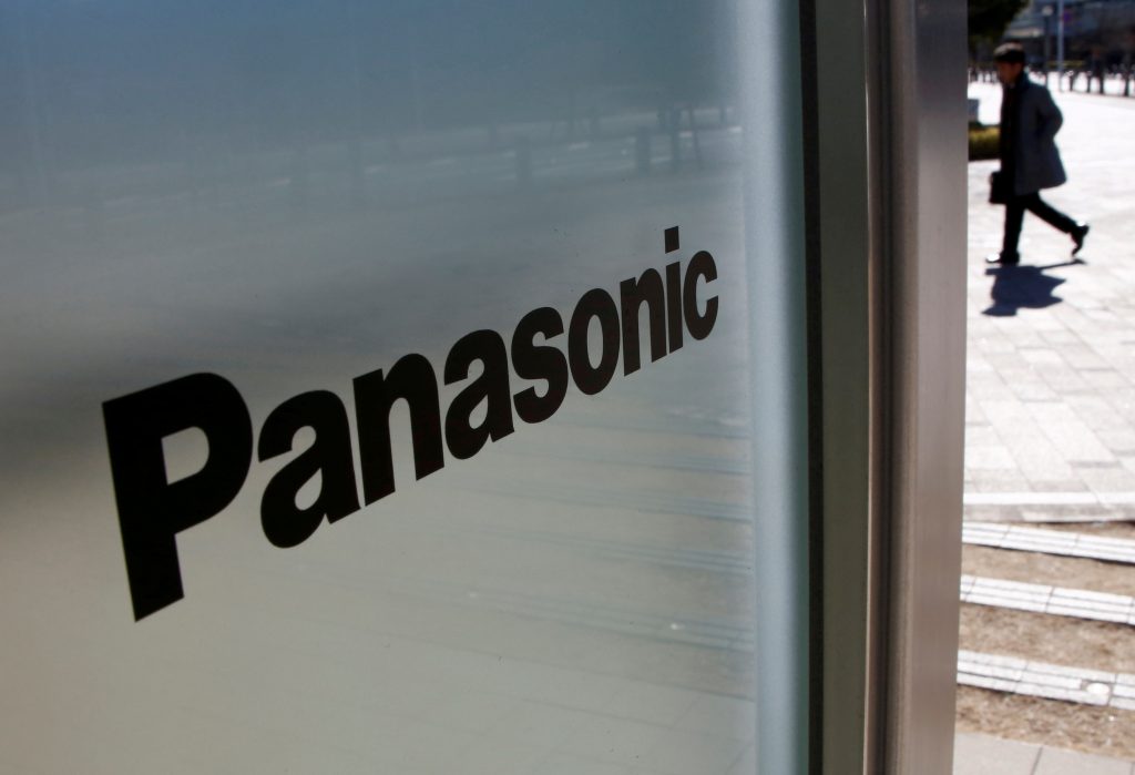 A man is seen next to Panasonic Corp's logo at Panasonic Center in Tokyo, Japan, Feb. 2, 2017. (File photo/ Reuters)