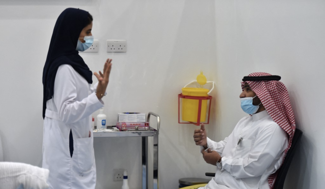 People wanting to board a plane or other public transport in Saudi Arabia will have to have received two doses of an approved COVID-19 vaccine. (File/AFP)