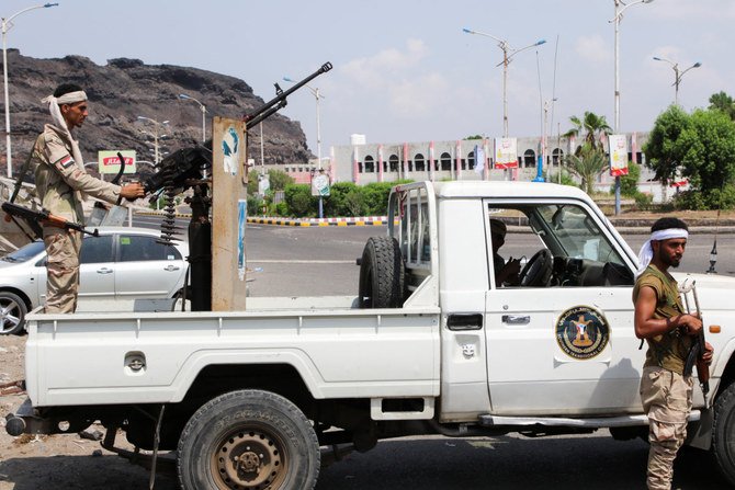 Members of the separatist Southern Transitional Council man a checkpoint in the southern Yemeni city of Aden on Saturday as residents were urged to remain at home. (Reuters)