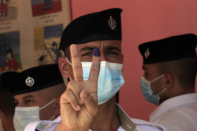 Iraqi security personnel across the country are casting their ballots Friday two days ahead of parliamentary election. (AP)