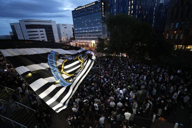 Fans react outside the stadium after Newcastle United announced takeover by PIF. (Reuters)