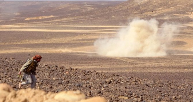 Smoke billows during clashes between forces loyal to Yemen's Saudi-backed government and Houthi rebel fighters in Al-Jadaan, northwest of Marib in central Yemen. (AFP/File)