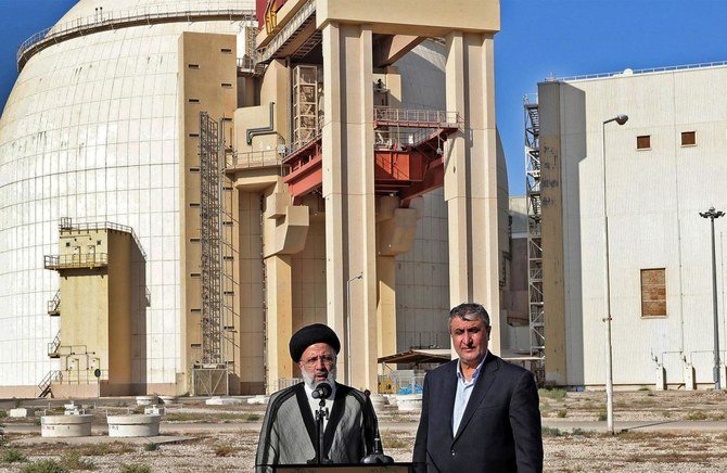 Iran’s president Ebrahim Raisi, right, with chief of the Atomic Energy Organization of Iran Mohammad Eslami, at the Bushehr Nuclear Power Plant on Oct. 8, 2021. (Iranian Presidency via AFP)