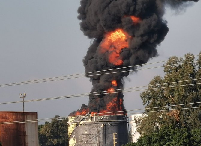 Smoke billows from a fire at the Zahrani oil facility in southern Lebanon on Oct. 11, 2021. (Reuters)