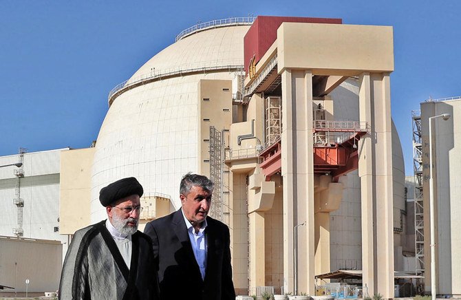 Iran’s president Ebrahim Raisi, left, is accompanied by chief of the Atomic Energy Organization of Iran Mohammad Eslami during a visit to the Bushehr Nuclear Power Plant. (Iranian Presidency via AFP)