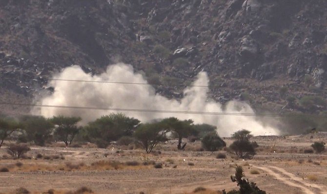 A grab from an AFPTV video shows smoke billowing while Yemeni pro-government fighters fire at positions of the Iran-backed Houthi militia in the strategic city of Marib. (File/AFP)