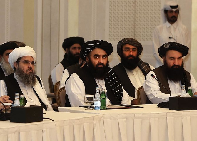 Members of the Taliban delegation Shahabuddin Delawar (L), Amir Khan Muttaqi, and Khairullah Khairkhwa (R) meet with foreign diplomats in Qatar's capital Doha, on October 12, 2021. (File/AFP)