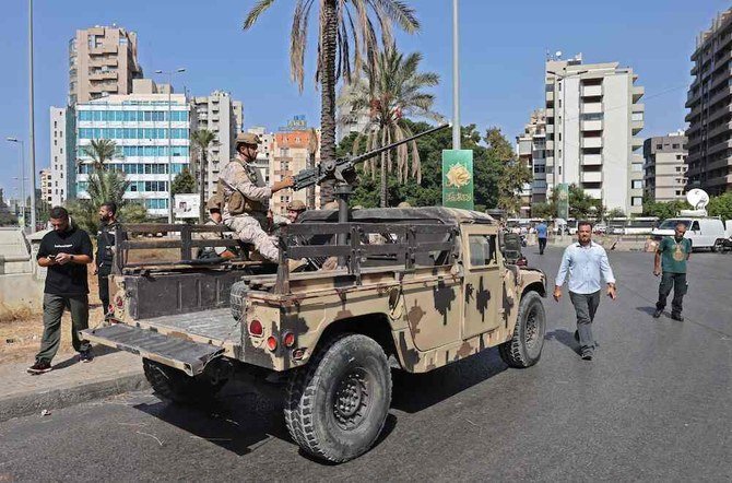 Lebanese army soldiers take a position in the area of Tayouneh in Beirut on Oct. 14, 2021. (AFP)