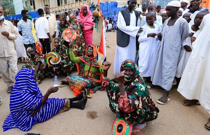 Sudanese protesters take part in a rally demanding the dissolution of the transitional government, outside the presidential palace in Khartoum on October 16, 2021. (AFP)