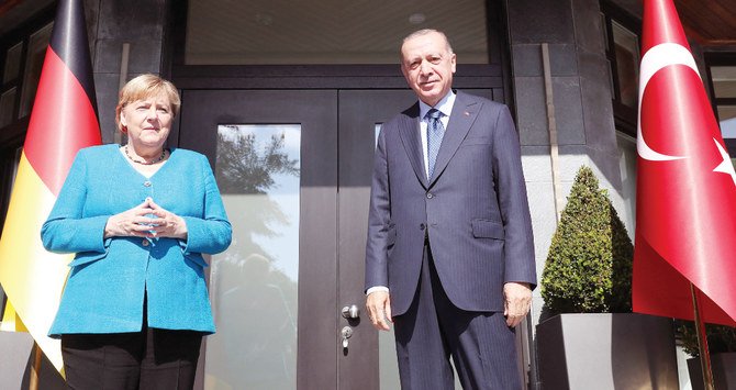 Turkish president Recep Tayyip Erdogan meeting with German chancellor Angela Merkel at Huber mansion in Istanbul on Saturday. (AFP)