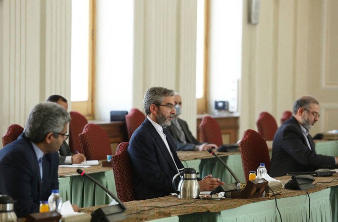 Iran's Deputy Foreign Minister Ali Bagheri (C) meeting with the EU envoy Enrique Mora (not in picture) in Tehran on Oct. 14, 2021. (Iranian Foreign Ministry via AFP)