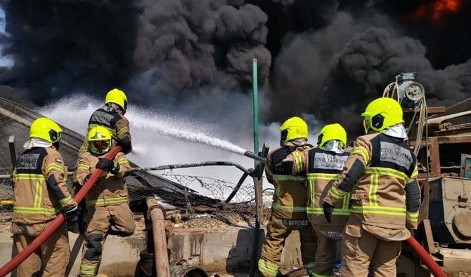 Dubai Civil Defense teams try to bring under control a fire that broke out at an oil waste disposal site in the Jebel Ali Industrial Area. (Twitter: @DXBMediaOffice)