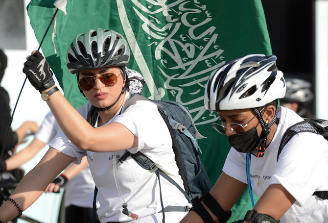 Saudi women take part in a cycling race to mark World Obesity Day celebration in Riyadh's Princess Nura University. (AFP/File Photo)