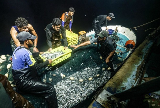 Gaza’s fishermen are forced to fish into the same small area, and struggle to catch enough to turn a profit. (AFP)