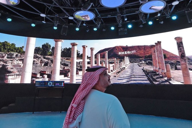 Above, a visitor at the Israel pavilion at the Expo 2020 Dubai in Dubai. (AFP)