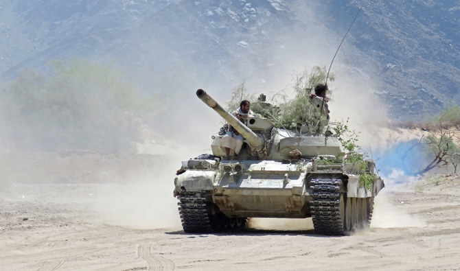Fighters loyal to Yemen’s legitimate government man a position near Al-Jawba frontline, facing Iran-backed Houthi rebels, in the country’s northeastern province of Marib. (AFP)