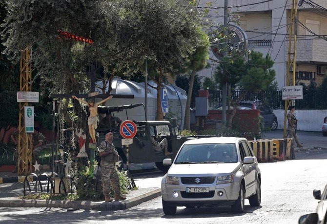 A Lebanese soldier mans a checkpoint in Ain Al-Remmaneh, adjacent to the area of Tayouneh, in the southern suburb of Beirut on October 15, 2021. (AFP)