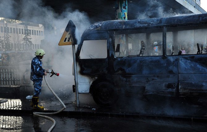 A bomb attack on an army bus in Damascus killed at least 13 people on Wednesday. (AFP)