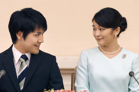 In this Sept. 3, 2017, file photo, Japan's Princess Mako and her fiance Kei Komuro look at each other during a press conference at Akasaka East Residence in Tokyo. (AP)