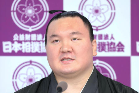 Retired Mongolian-born sumo champion Hakuho attends a press conference at Ryogoku Kokugikan in Tokyo on October 1, 2021. (AP)
