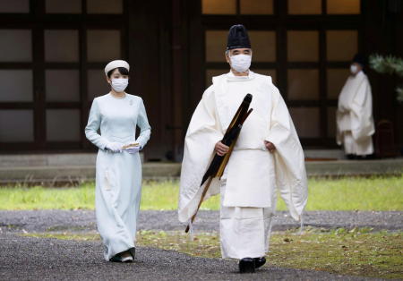 Japan's Princess Mako, the daughter of Crown Prince Akishino and Crown Princess Kiko, walks towards the Three Palace Sanctuaries to pray ahead of her marriage at the Imperial Palace in Tokyo, Japan October 19, 2021, in this photo taken by Kyodo. (Reuters)