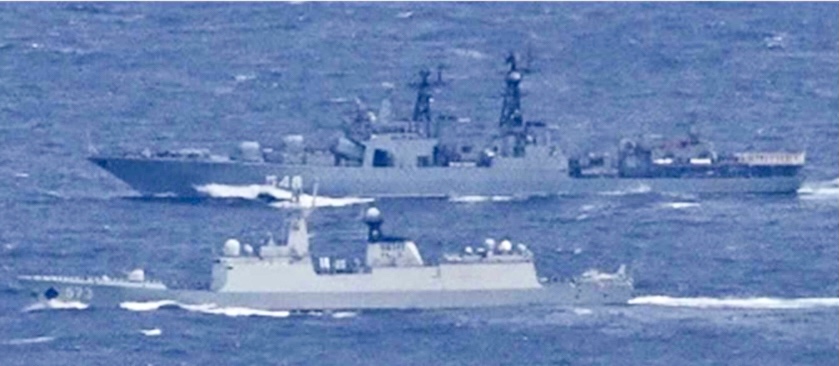 A photo released by the Ministry of Defense in Tokyo on October 23 showing a Chinese Navy Frigate (front) and Russian Navy Destroyer (back) as they passed through Tsugaru and Osumi straits.