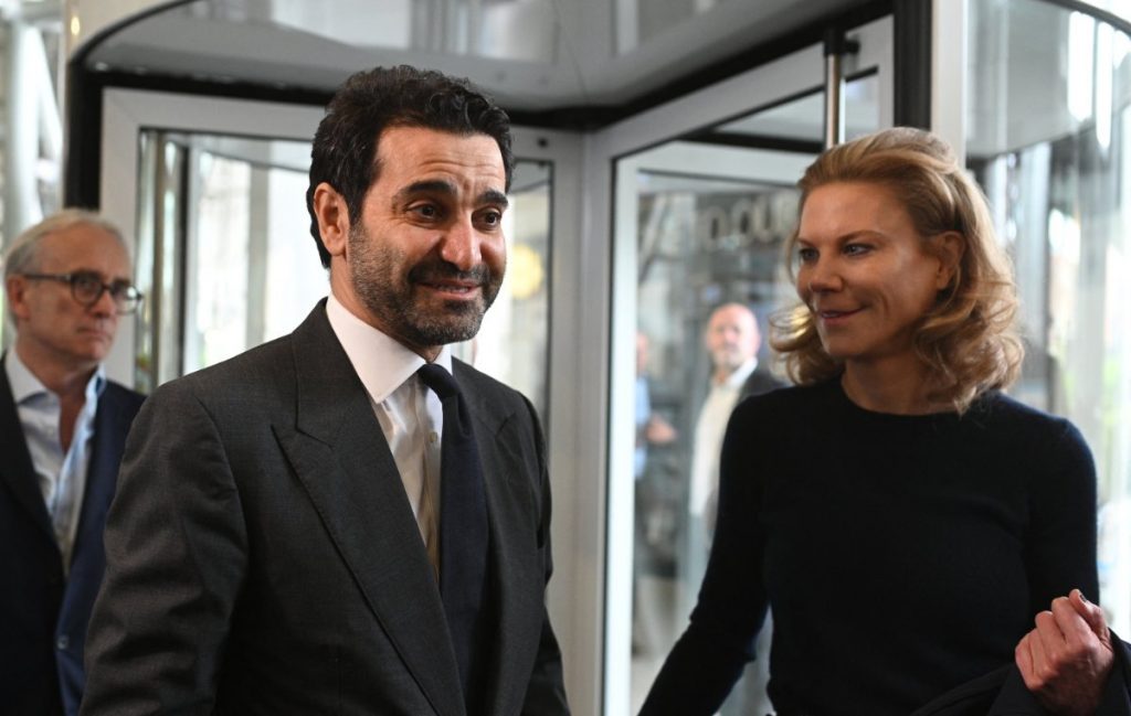 Newcastle United's new director Amanda Staveley (R) and husband Mehrdad Ghodoussi (L) talk to the media on Oct. 8, 2021, after the sale of the football club. (Photo by Oli Scarff / AFP)