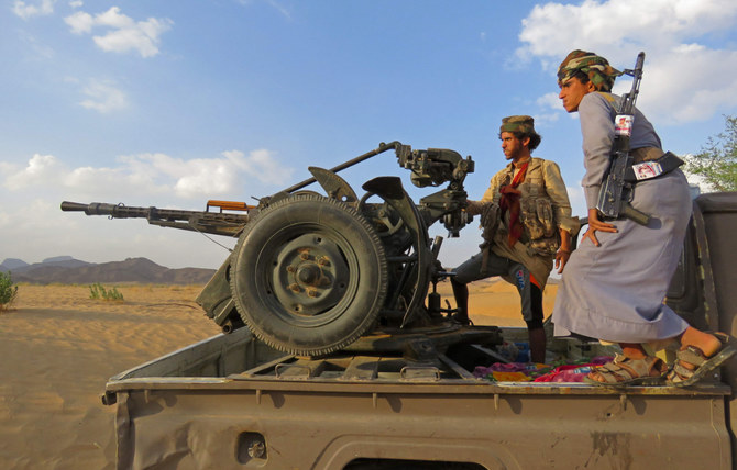 Fighters loyal to Yemen’s government man a position near Al-Jawba frontline, facing Iran-backed Houthis, in the country’s northeastern province of Marib. (File/AFP)