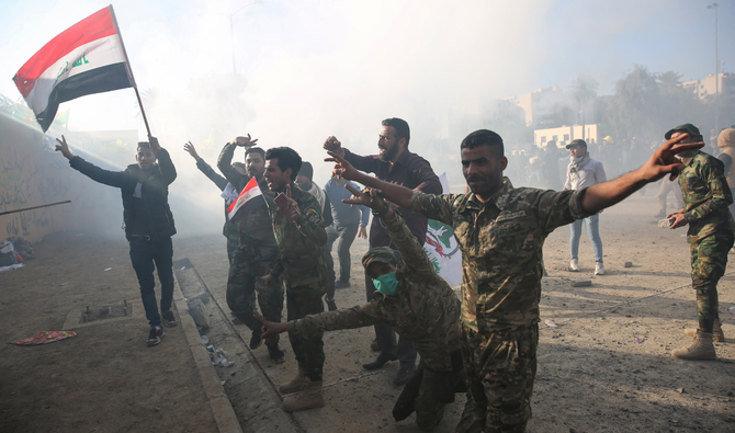 The influence of Iran on its neighbor was felt in 2019, when pro-Shiite militia demonstrators attacked the US Green Zone compound. (AFP)