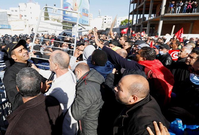 Demonstrators protest against Tunisian President Kais Saied's seizure of governing powers, in front of the parliament, in Tunis, Tunisia, November 14, 2021. (Reuters)