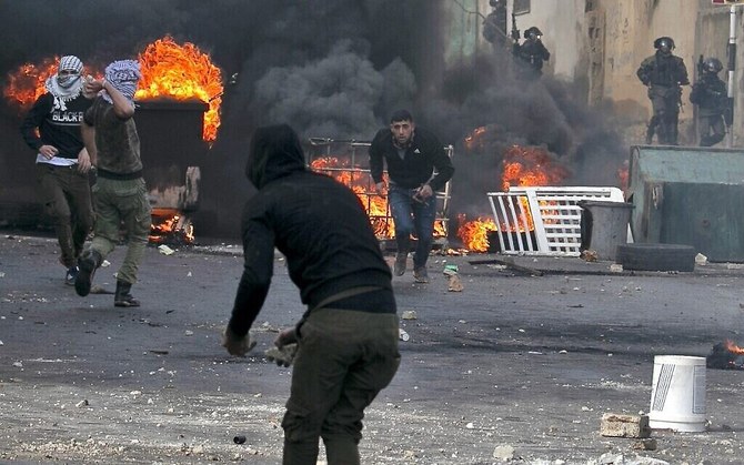 Palestinians clash with Israeli security forces in the northern West Bank village of Azzun, on February 7, 2020. (File/AFP)