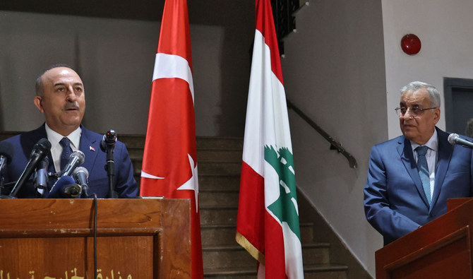 Turkish Foreign Minister Mevlut Cavusoglu (L) and his Lebanese counterpart Abdallah Bou Habib hold a joint-press conference in Lebanon's capital Beirut, on November 16, 2021. (AFP)