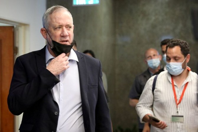 Israeli Defence Minister Benny Gantz walks past the media during the weekly cabinet meeting in Jerusalem, August 1, 2021. (Reuters)