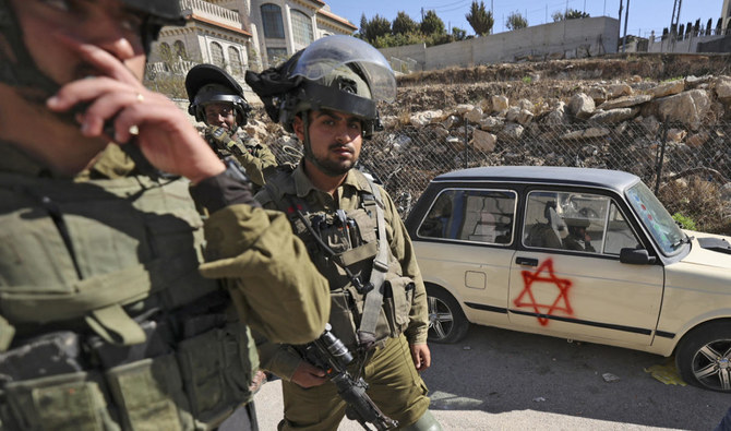 In mid-November, dozens of settlers attacked a group of Palestinians and Israeli activists with stones and clubs, hospitalizing a woman and wounding several others. (AFP/File)