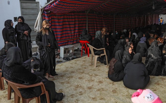 Women attend a condolence ceremony for Iraqi Kurdish migrant Maryam Nuri Hama Amin, also known as Baran, in the Kurdish town of Soran, 100 kilometres northeast of Arbil on November 27, 2021. (AFP)