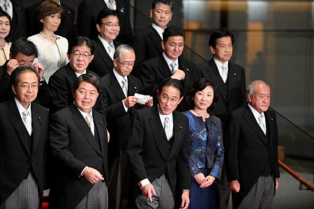 Japan's Prime Minister Fumio Kishida (centre, bottom) poses with his new cabinet members in Tokyo on November 10, 2021. (AFP)