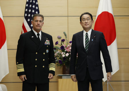 Adm. John Aquilino (left), Commander of the United States Indo-Pacific Command, and Japan's Prime Minister Fumio Kishida pose for a photo as they meet at his official residence in Tokyo, Japan, Thursday, Nov. 11, 2021. (AP)