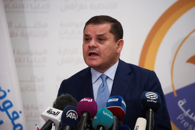Libyan Prime Minister Abdulhamid Al-Dbeibah speaks after submitting his candidacy papers for the upcoming presidential election at the headquarters of the electoral commission in Tripoli, Libya November 21, 2021. (Reuters)
