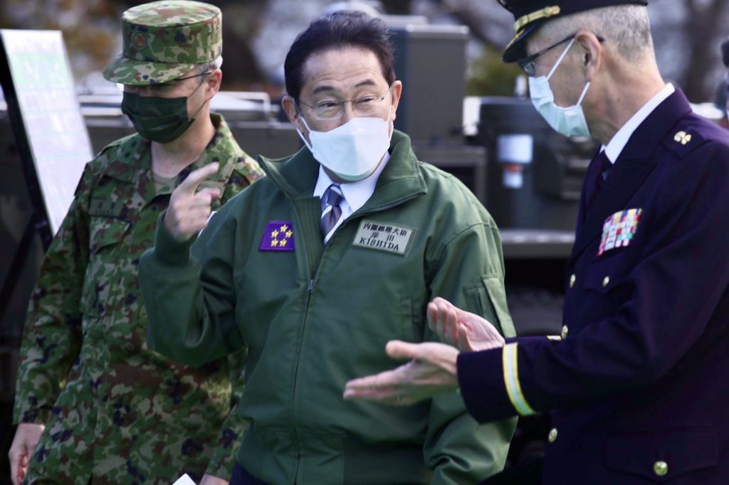 Japanese PM KISHIDA Fumio chats with Defense minister Kishi and an SDF General as he attended a troop review at the Ground Self-Defense Force's Camp Asaka in the Tokyo area.(ANJ Photo)