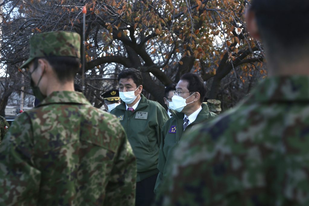 Japanese PM KISHIDA Fumio chats with Defense minister Kishi and an SDF General as he attended a troop review at the Ground Self-Defense Force's Camp Asaka in the Tokyo area.(ANJ Photo)