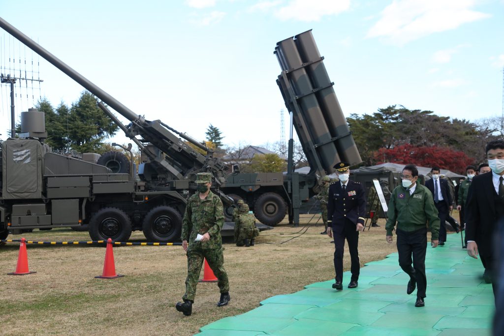 Japanese PM KISHIDA Fumio chats with Defense minister Kishi and an SDF General as he attended a troop review at the Ground Self-Defense Force's Camp Asaka in the Tokyo area.(ANJ Photo)