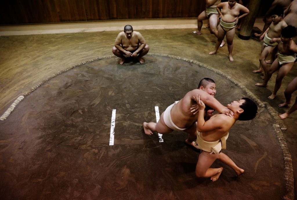 Elementary school sumo wrestler Kyuta Kumagai practises ahead of the All-Japan Elementary School Sumo Championship at Komatsuryu sumo club in Tokyo, Japan, December 1, 2021. (AFP)