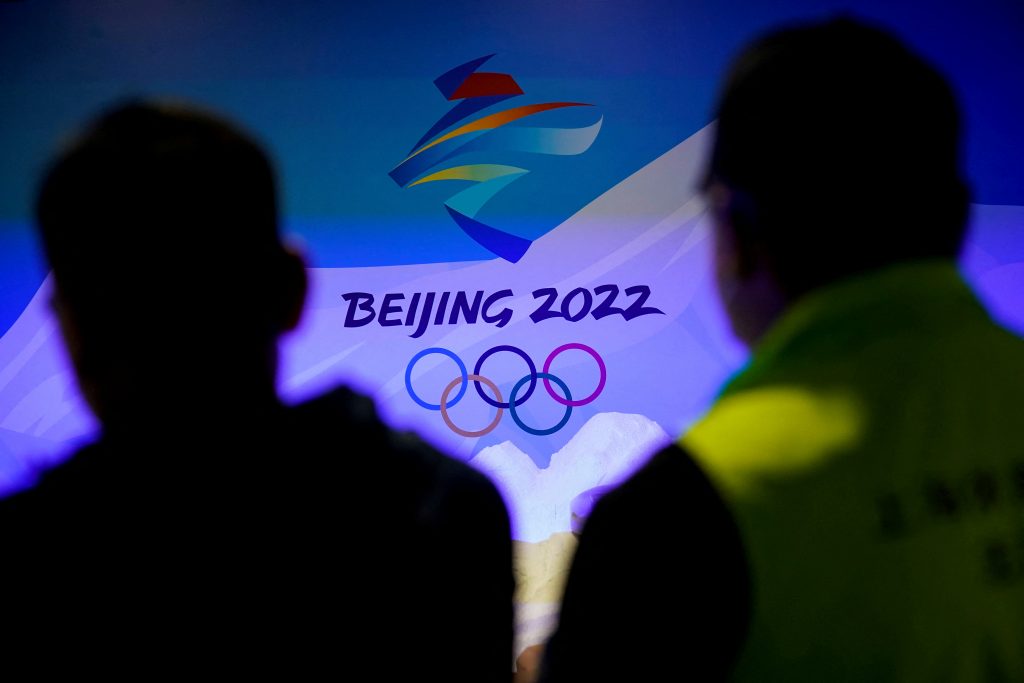 Staff members work near the emblem for Beijing 2022 Winter Olympics displayed at the Shanghai Sports Museum in Shanghai, China. (File photo/Reuters)